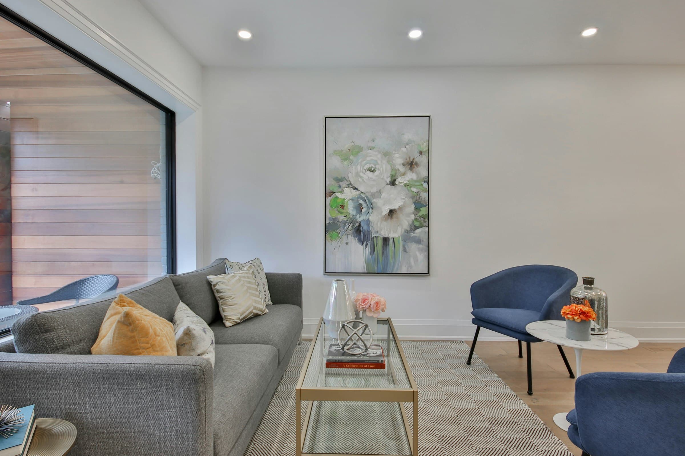 A sophisticated living room with freshly painted walls and designer furnishings